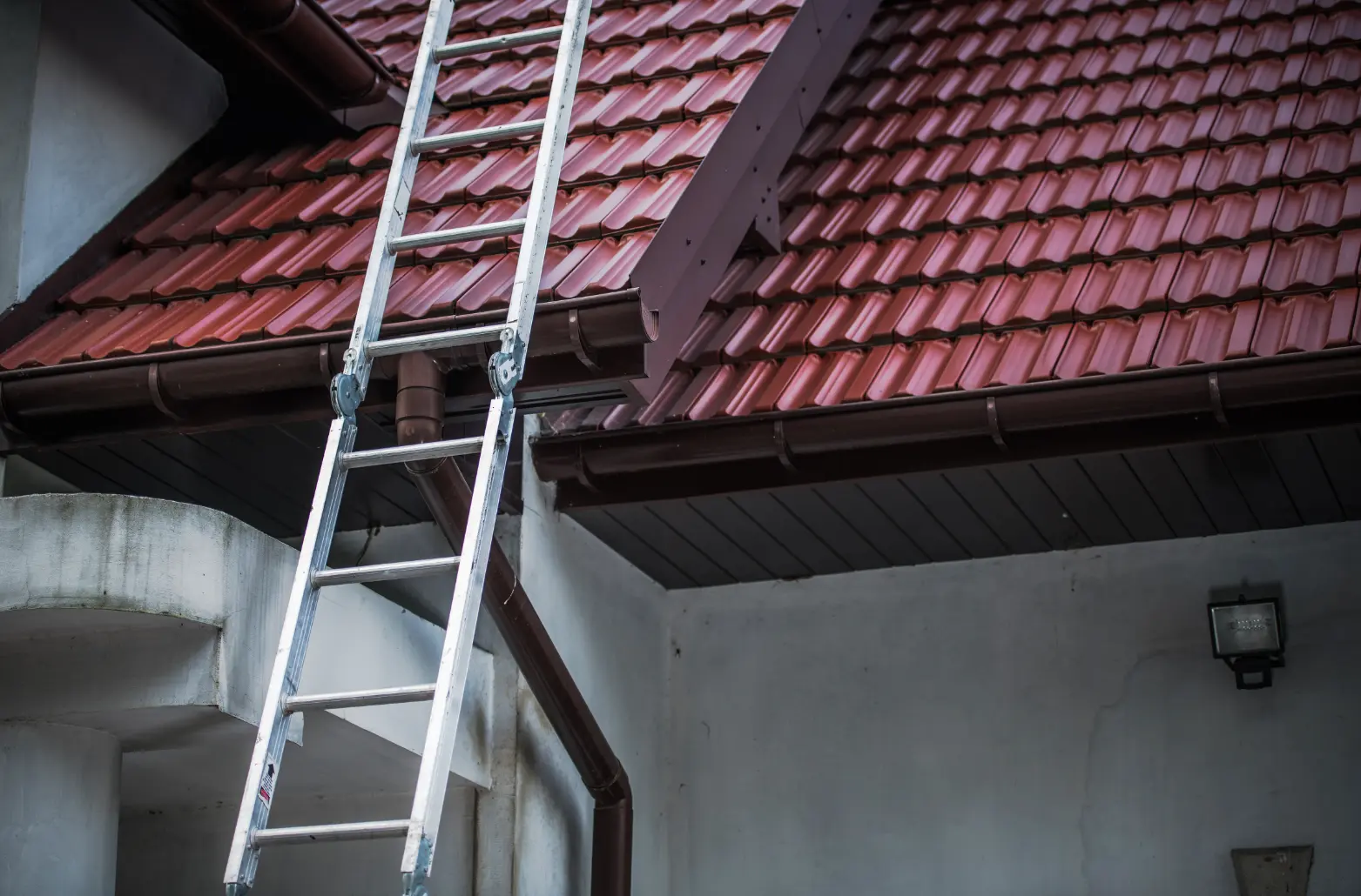 Ladder set up for roof and gutter access